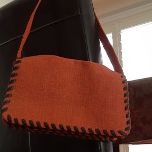 Cute small orange purse with black stitching